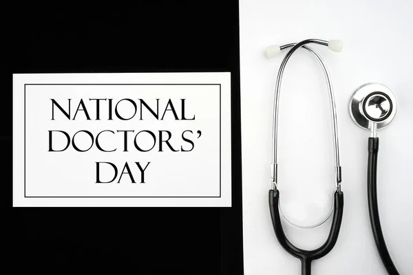 Thank you Doctors. Doctor\'s Day concept. Medical apparatus such as stethoscope and spiral notepad with \