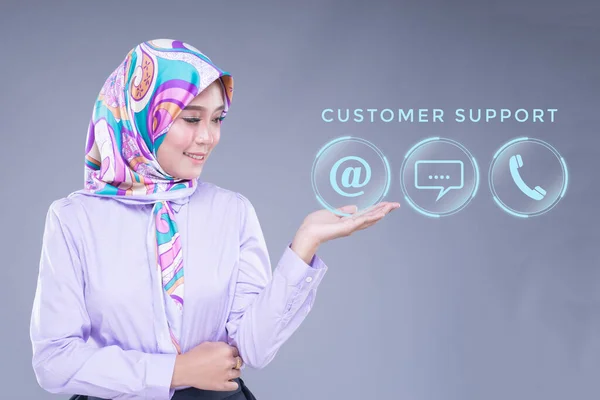 Attractive Muslim Woman Office Wear Hijab Presenting Customer Service Icons — стоковое фото
