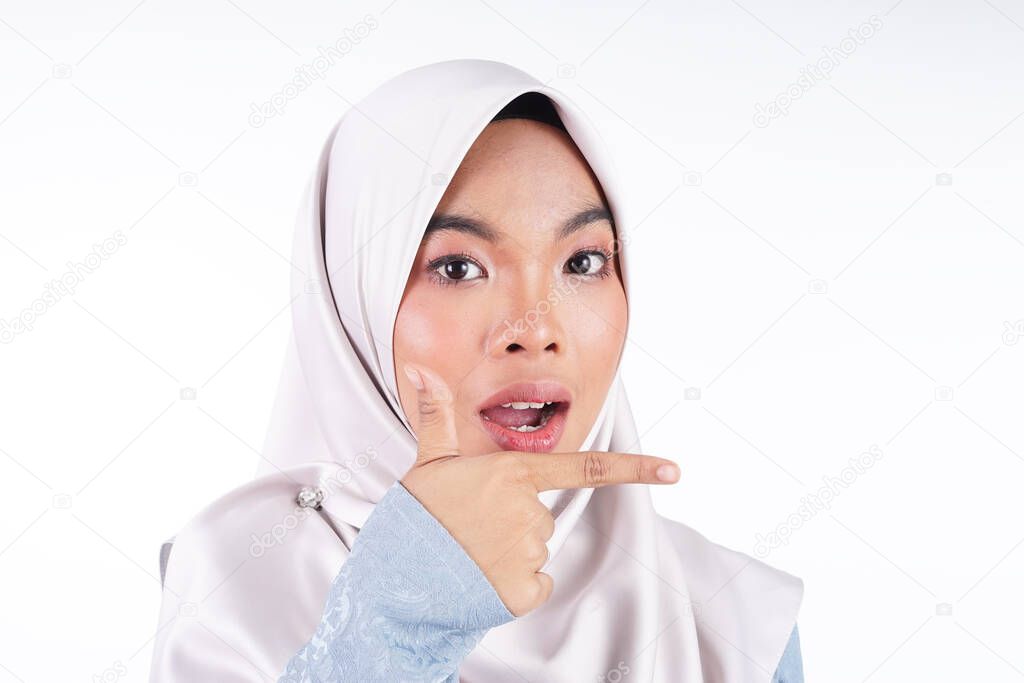 Headshot of a cute Muslim teenager wearing hijab showing various facial expressions isolated on white background. Landscape orientation.