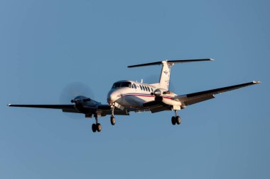 Adelaide, Australia - June 10, 2013: Royal Flying Doctors Service of Australia Beechcraft Super King Air 200 twin engined turboprop aircraft on approach to land at Adelaide Airport. clipart