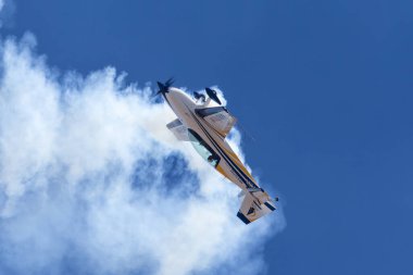 Avalon, Australia - March 3, 2013: British aerobatic pilot Mark Jefferies flying a single engine Extra 330LX aerobatic aircraft VH-IXN. clipart