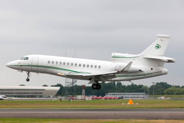 Farnborough, UK - July 20, 2014: Dassault Falcon 7X (M-CELT) private jet, owned by Dermot Desmond, billionaire businessman and owner of Celtic Football Club. clipart