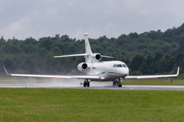 Farnborough, UK - July 19, 2014: Dassault Falcon 7X (M-CELT) private jet, owned by Dermot Desmond, billionaire businessman and owner of Celtic Football Club. clipart