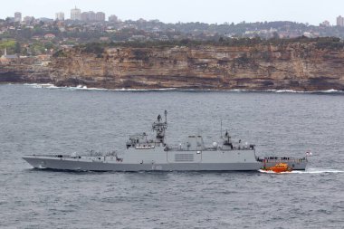 Sydney, Australia - October 11, 2013: INS Sahyadri (F49) Shivalik-class stealth multi-role frigate of the Indian Navy departing Sydney Harbor. clipart