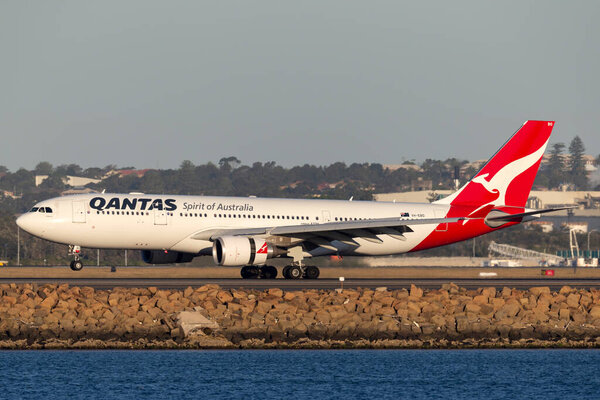 Sydney, Australia - October 9, 2013: Qantas Airbus A330 large passenger airliner landing at Sydney Airport.
