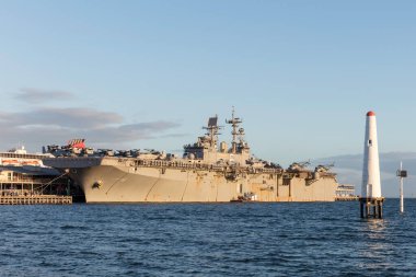 Melbourne, Australia - August 30, 2017: USS Bonhomme Richard (LHD-6) Wasp-class amphibious assault ship of the United States Navy docked at Station Pier in Melbourne Australia with Helicopters from the United States Marine Corps on the deck.  clipart