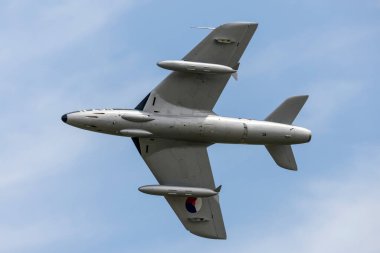 RAF Waddington, Lincolnshire, UK - July 4, 2014: The Dutch Hawker Hunter Foundation Hawker Hunter F.6A G-KAXF. clipart