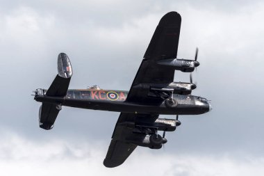 RAF Waddington, Lincolnshire, UK - July 5, 2014: Royal Air Force (RAF) Battle Of Britain Memorial Flight Avro Lancaster bomber PA474 aircraft.  clipart
