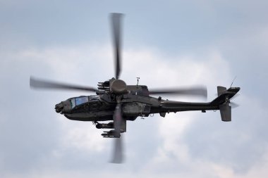 RAF Waddington, Lincolnshire, UK - July 6, 2014: AgustaWestland WAH-64D Apache AH1 Attack helicopter ZJ 172 of the British Army Air Corps.  clipart