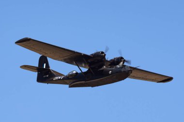 Temora, Australia - November 2, 2013: Consolidated PBY Catalina Flying boat VH-PBZ operated by the Royal Australian Air Force (RAAF) during World War II. clipart