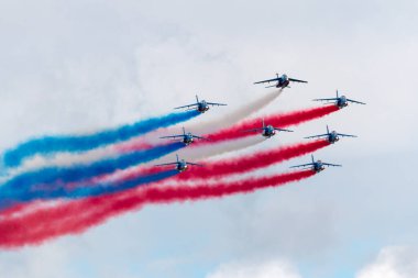 Payerne, Switzerland - August 30, 2014: Patrouille de France, the aerobatic display team of the French Air Force (Armee de lAir) flying Dassault-Dornier Alpha Jet E jet trainer aircraft. 