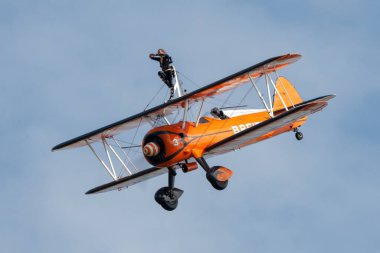 Payerne, Switzerland - August 29, 2014: Breitling Wing walkers barnstorming flying display in vintage Boeing Stearman biplanes.