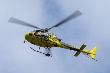 Payerne, Switzerland - August 29, 2014: Yves Rossy also know as Jetman prepares to exit the Eurocopter AS350 helicopter with his jet powered wings on his back. 