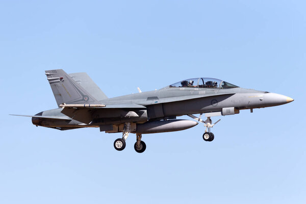 Temora, Australia - November 1, 2013: Royal Australian Air Force (RAAF) McDonnell Douglas F/A-18B Hornet jet aircraft A21-115 from No. 2 Operational Conversion Unit based at RAAF Williamtown.