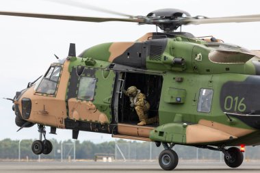 Avalon, Australia - February 27, 2015: MRH-90 Taipan multirole military helicopter jointly operated by the Australian Army and Navy. clipart