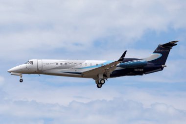 Avalon, Australia - February 22, 2015: Embraer Legacy 650 large business jet aircraft N671EE on approach to land at Avalon Airport. clipart