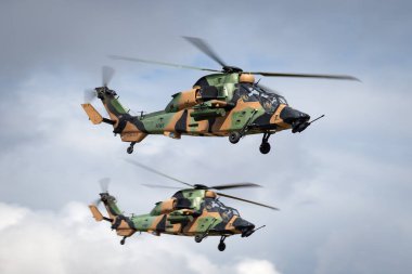 Avalon, Australia - February 26, 2015: Two Australian Army Eurocopter Tiger ARH Armed reconnaissance helicopters. clipart