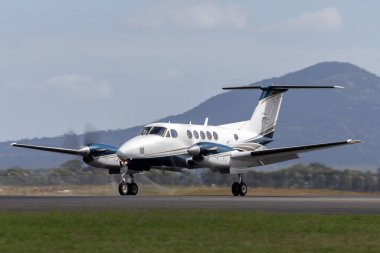 Avalon, Australia - February 26, 2015: Beech B200 Super King Air twin engine turboprop aircraft on the runway at Avalon aIrport. clipart