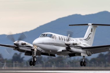 Avalon, Australia - February 27, 2015: Royal Australian Air Force (RAAF) Beechcraft King Air 350 Aircraft from 38 Squadron on approach to land at Avalon Airport. clipart