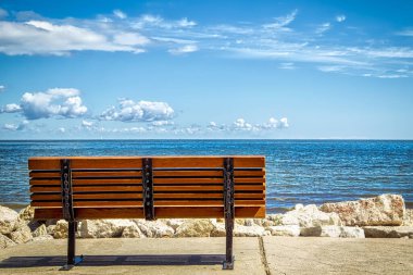 A park bench overlooking Green Bay from Bay Beach Park (Green Bay, Wisconsin) clipart