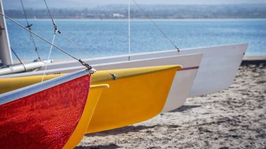A beach with sailboats on the Silver Strand near San Diego, CA. clipart