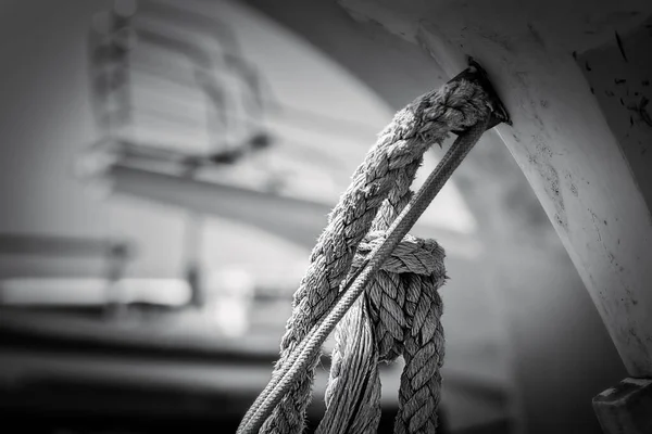 Ropes connected to the hull of a boat sitting on a ramp near Yokosuka at the harbor of Arisaki, Japan.
