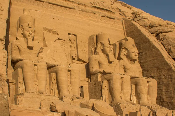 Four colossal 20 meter statues of Ramses. Abu Simbel temples, two massive rock temples on the western bank of Lake Nasser, 300 km south-west of Aswan, Nubia, Egypt.