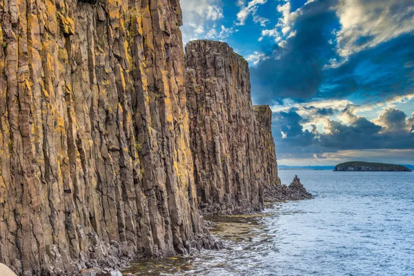 Stunning coastal basalt column rock formations, Stykkisholmur harbor, Snaefellsnes peninsula, Iceland