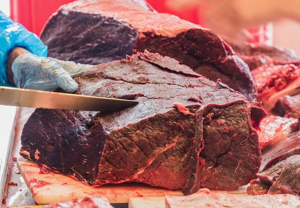 Freshly caught Minke Whale for Sale at a Butcher in Nuuk, Greenland. This is a seasonal delicacy, strictly regulated by a government quota system, that allows the Inuit population to continue its special culinary tradition