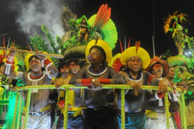 Rio de Janeiro, February 27, 2017.Cacique Raoni Metuktire of the Caiapo ethnic group with Indians of his tribe during a parade of the samba school Imperatriz Leopoldinense at Sambodromo in the city of Rio de Janeiro. clipart