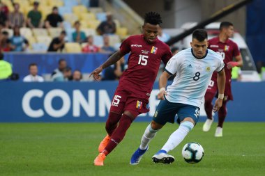 Rio de Janeiro, Brazil, June 28, 2019.The soccer players dispute the ball, during the Venezuela vs Argentina match for Copa America 2019, in the Maracan stadium.