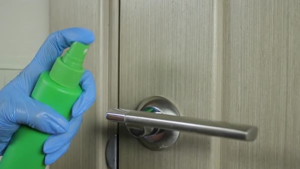 Human Hand Latex Glove Applies Disinfectant Antiviral Spray Handle Door — Stock Video