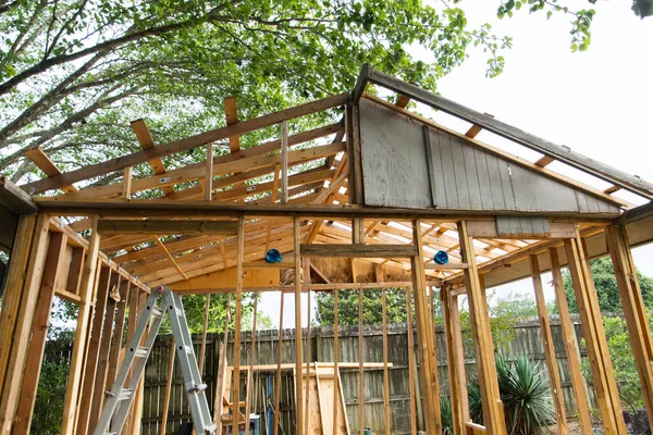 Backyard shed cottage being demolished due to rotting wood and poor construction