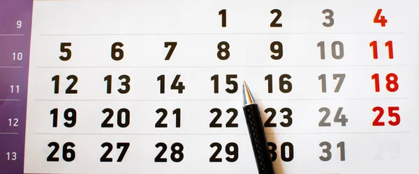 business calendar concept, black pencil on number 15, checking out the dates, panoramic view