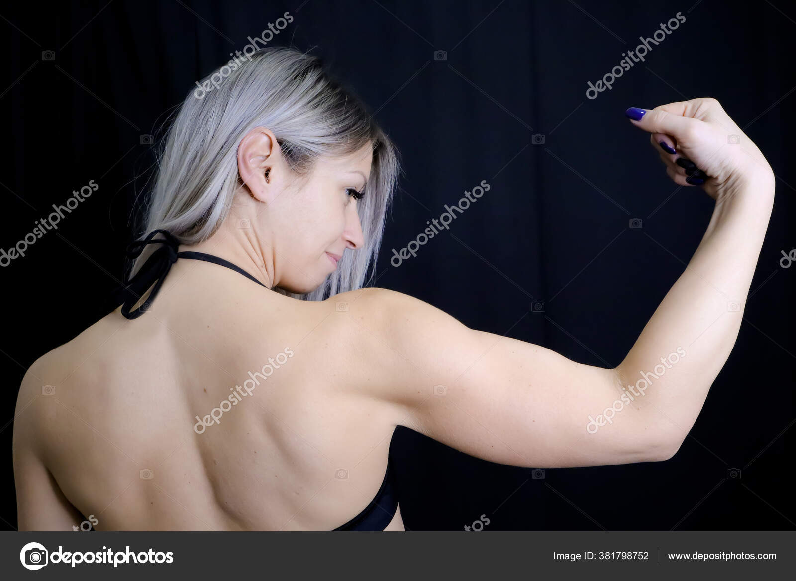 Beautiful Strong Muscular Woman Shows Her Biceps Arm Muscles View