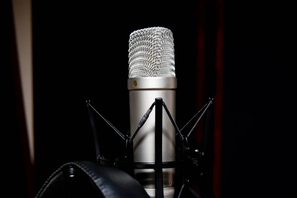isolated retro microphone in studio on black background