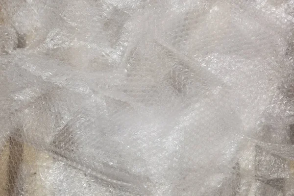 Bubble wrap on the wooden floor. — Stock Photo, Image