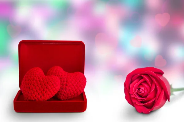 red heart in red box and red rose on abstract background, valentine\'s day background