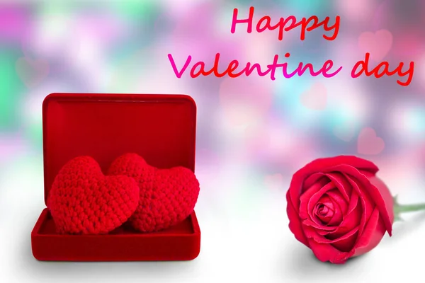 red heart in red box and red rose on abstract background, valentine's day background