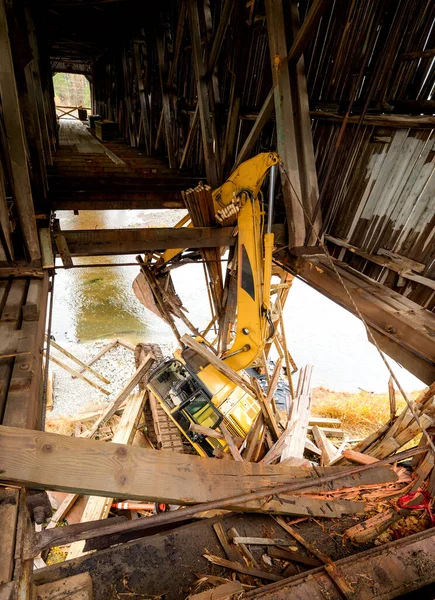 Large Construction Equipment Crashed Bottom Wooden Covered Bridge Arm Backhoe — Stock Photo, Image