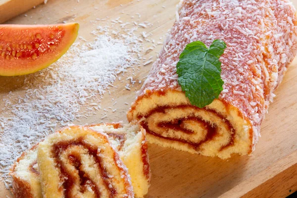 (Swiss roll, Roll cake) typical Brazilian dessert, from the northeast region. Sliced cake roll with guava paste.