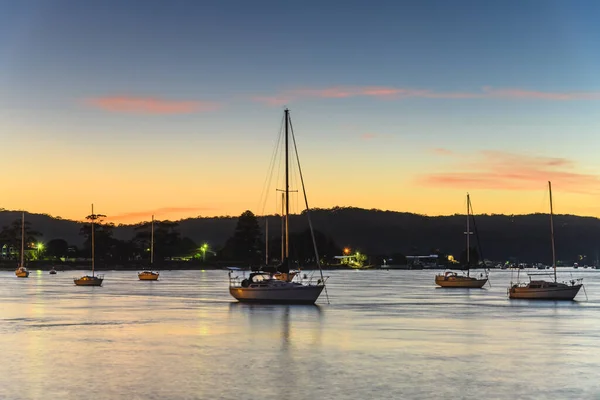 Sunrise and Boats from the Esplanade at Ettalong Beach on the Central Coast, NSW, Australia.