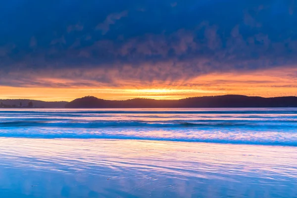 Cloud covered sunrise from Umina Point at Umina Beach on the Central Coast, NSW, Australia.