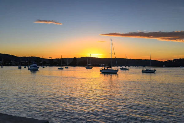 Sunrise and Boats from the Esplanade at Ettalong Beach on the Central Coast, NSW, Australia.