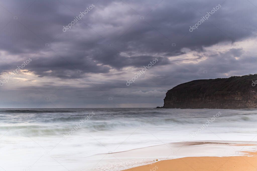 Moody sunrise seascape from MacMasters Beach on the Central Coast, NSW, Australia.