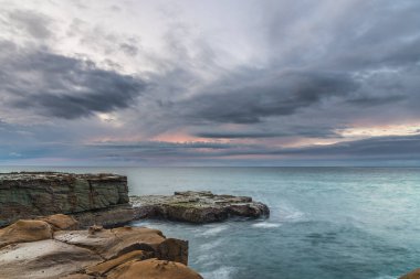 Overcast Sunrise Seascape from North Avoca Beach on the Central Coast, NSW, Australia. clipart