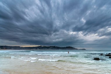 Clouds and the sea, early morning at Avoca Beach on the Central Coast, NSW, Australia. clipart
