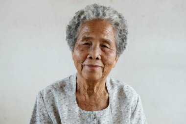 Smilling of happy Asian elderly senior on white background clipart