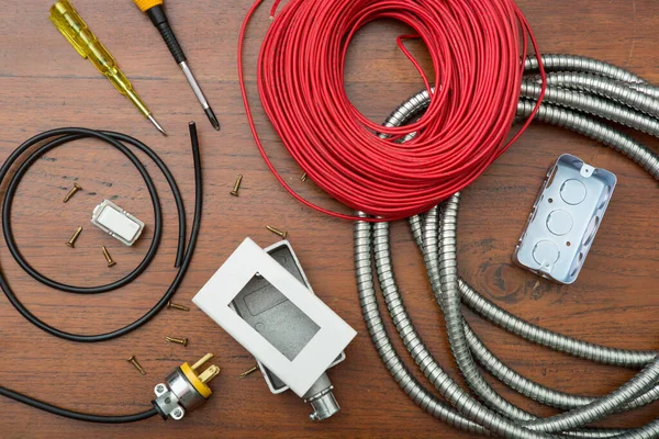 Electrical Equipment and electrical tools with cable on wooden table