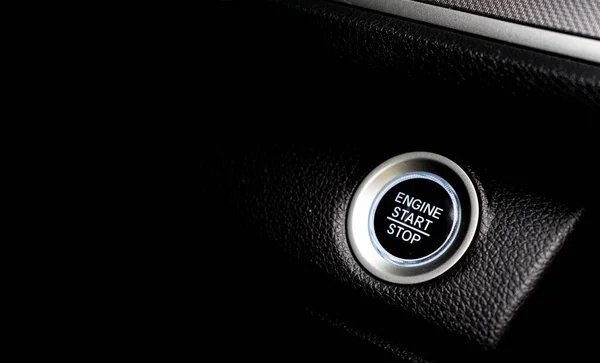 Car start stop engine button close up.
